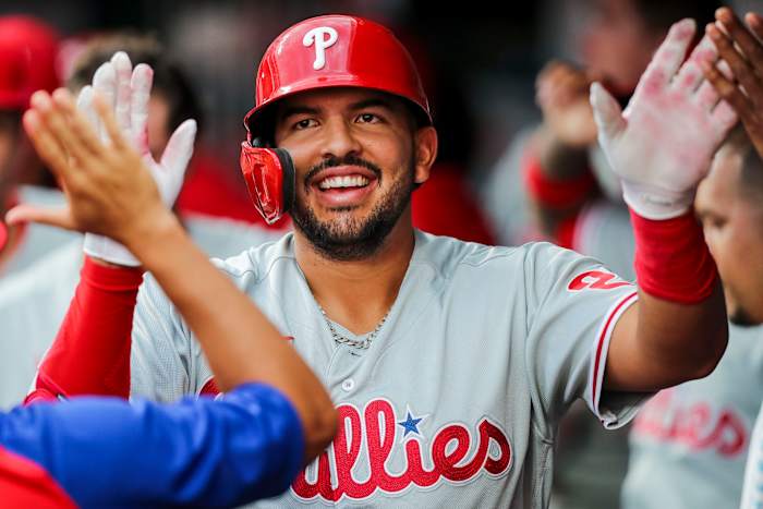 Darick Hall being congratulated in the dugout.